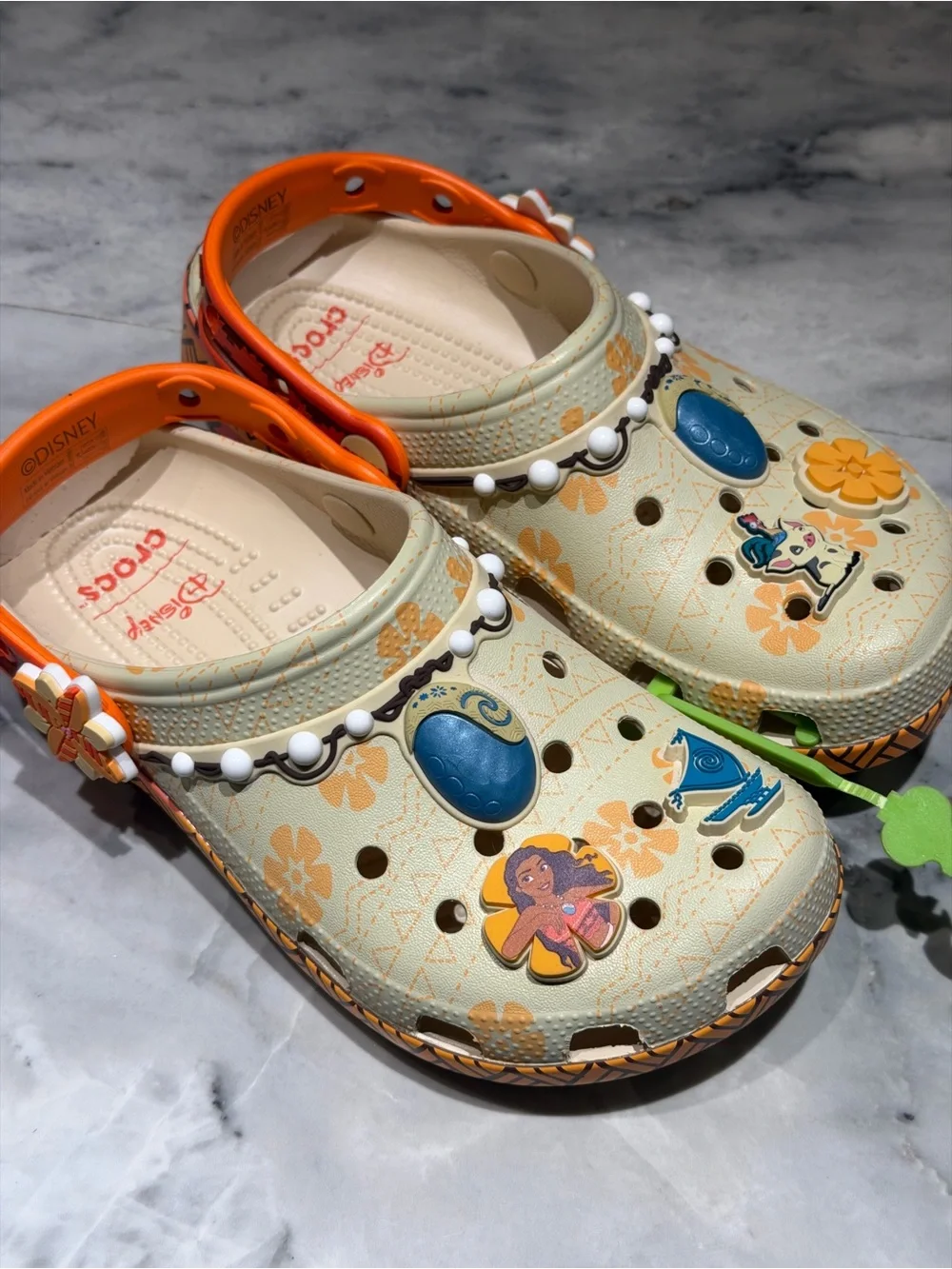 CROCS Kids Beige Orange Floral Moana Themed Clogs with Blue and orange Charms